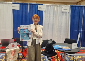Ligia Hofnar, Marketing Manager of Italiabsolutely, at the Italiabsolutely booth at the Las Vegas Travel Agent Forum.