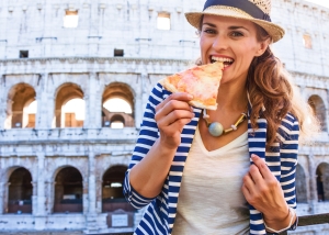Tourist eating pizza in Rome